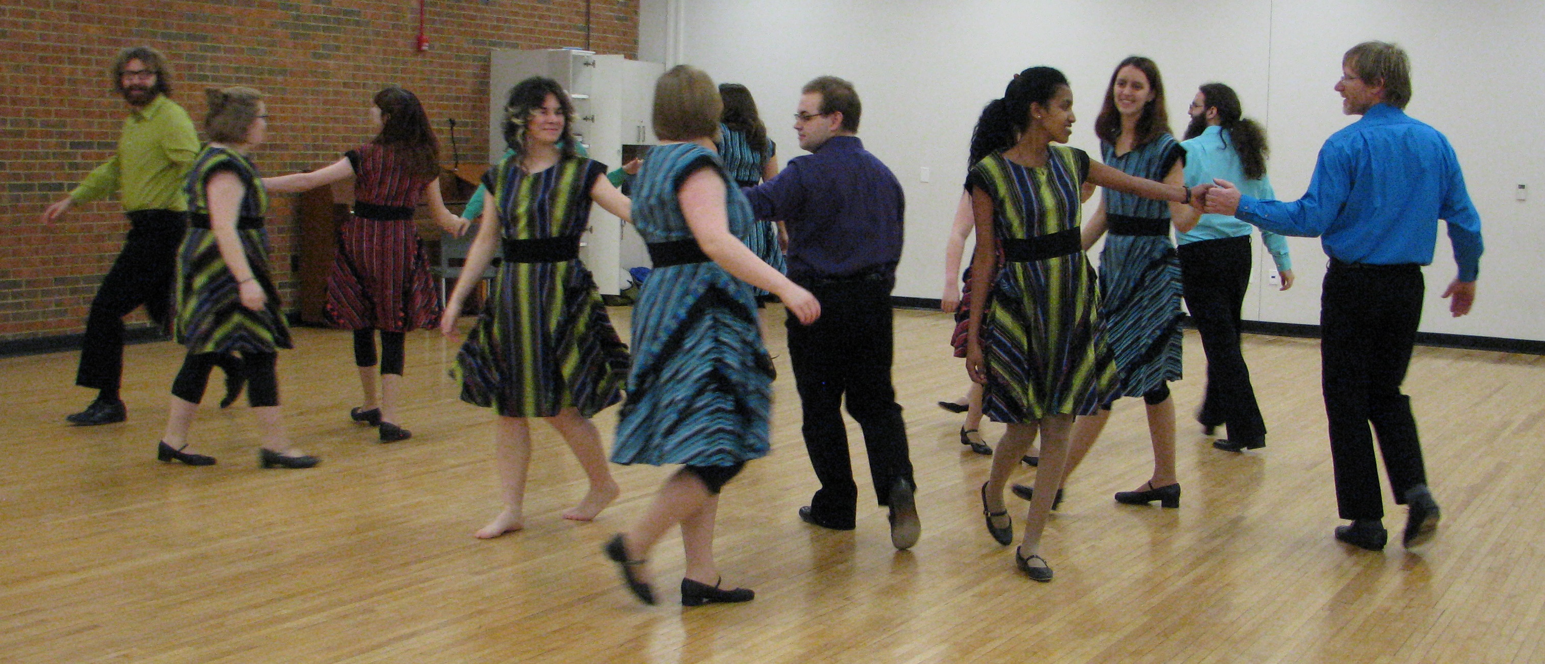 Female and male dancers practicing their left hand stars.